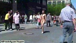 Naked babe has fun in streets - porn video