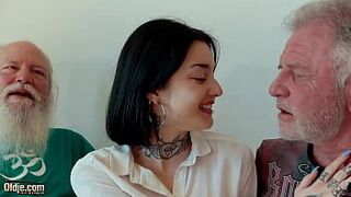 Young brunette has threesome with old men and she swallows cum - porn video